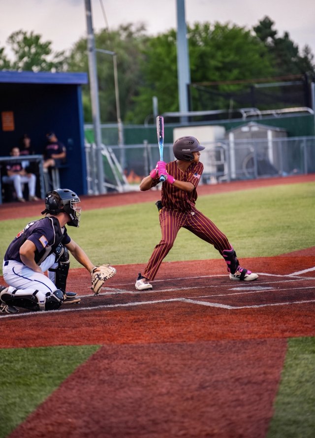 Baseball batter at home plate with the catcher